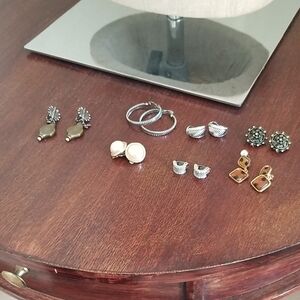 7 Pairs Of Clip On Earrings.